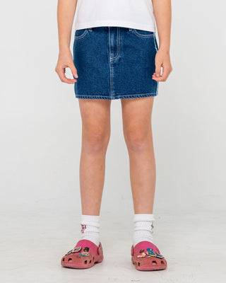 Girl wearing Flip Girl Mini Denim Skirt in Deep Sea Blue