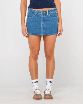 Woman wearing Flip Mommy Low Rise Mini Denim Skirt in Middy Blue / Lime