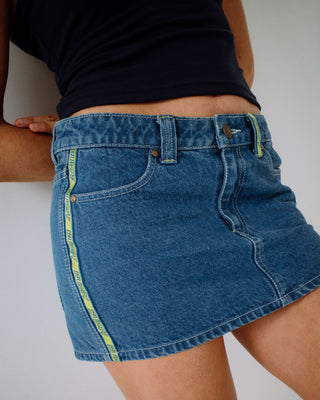 Woman wearing Flip Mommy Low Rise Mini Denim Skirt in Middy Blue / Lime