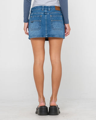 Woman wearing Mavericks Low Rise Denim Mini Skirt in Blasted Middy Blue