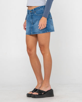 Woman wearing Mavericks Low Rise Denim Mini Skirt in Blasted Middy Blue
