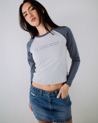 Woman wearing Mavericks Low Rise Denim Mini Skirt in Blasted Middy Blue