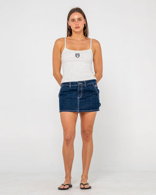 Woman wearing Billie Low Rise Denim Mini Skirt in Indigo