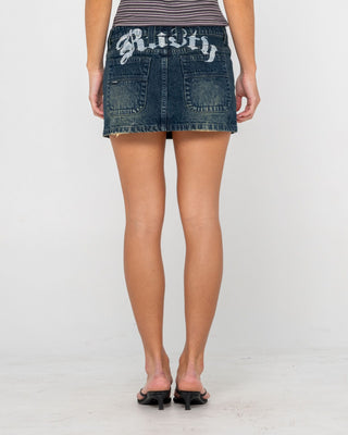 Woman wearing Roxanne Low Rise Denim Micro Mini Skirt in Dark N Dirty