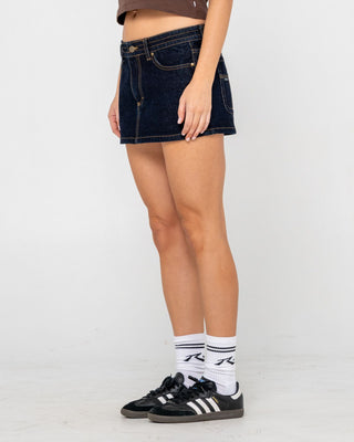 Woman wearing Tripper Raw Low Rise Denim Micro Skirt in Raw Dawg Blue