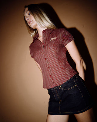 Woman wearing Tripper Raw Low Rise Denim Micro Skirt in Raw Dawg Blue