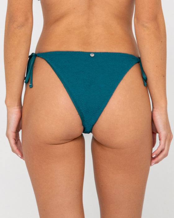 woman-wearing-sandalwood-midi-side-ties-bikini-bottom-in-deep-teal