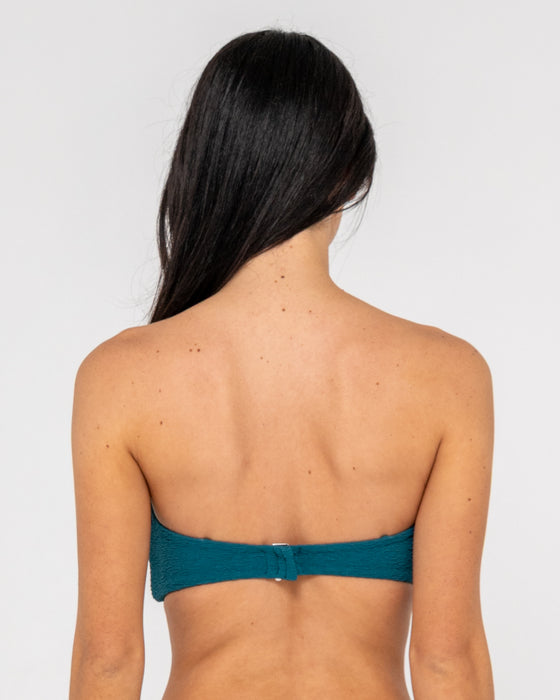 woman-wearing-sandalwood-bandeau-twist-bikini-top-in-deep-teal