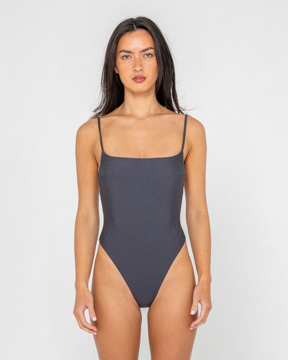woman-wearing-shadow-hi-leg-one-piece-in-carbon