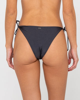 Woman wearing Shadow Midi Side Ties Bikini Bottom in Carbon