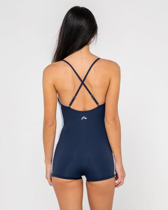 woman-wearing-timmy-target-contrast-romper-one-piece-in-navy-blue