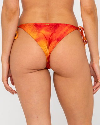 Woman wearing Sunrise Midi Side Ties Bikini Bottom in Sunset Orange