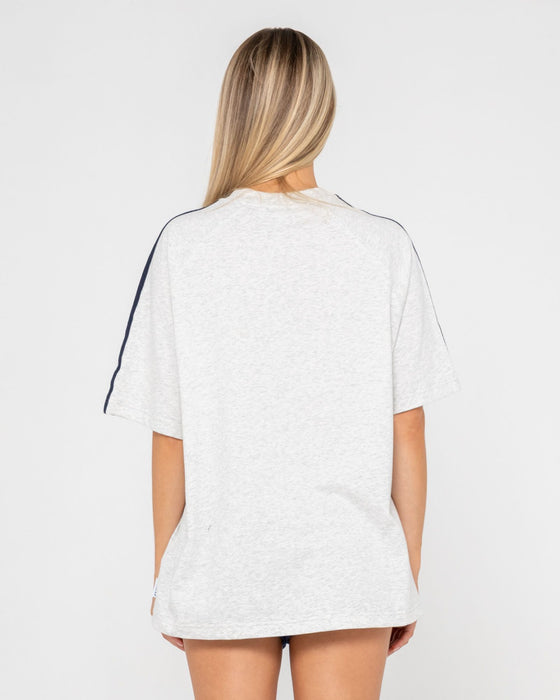 woman-wearing-all-saint-collegiate-og-oversize-tee-in-ecru-marle