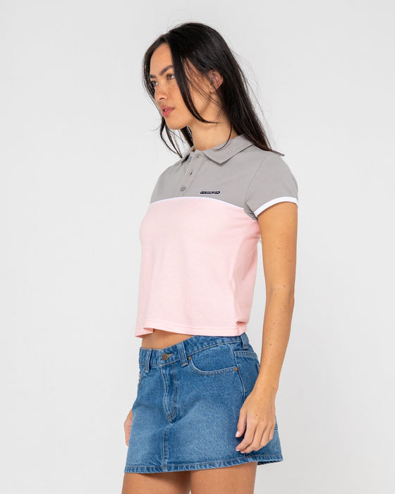 woman-wearing-insert-dad-joke-baby-polo-tee-in-pink-grey