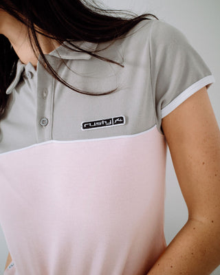 Woman wearing Insert Dad Joke Baby Polo Tee in Pink / Grey