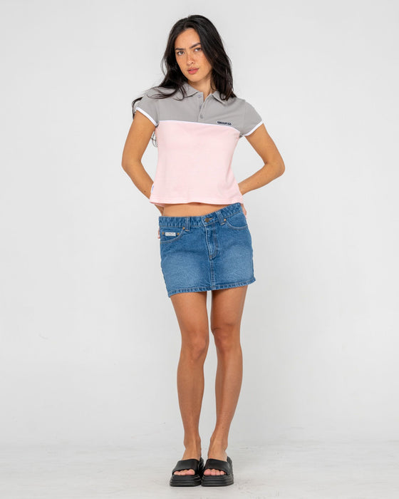 woman-wearing-insert-dad-joke-baby-polo-tee-in-pink-grey