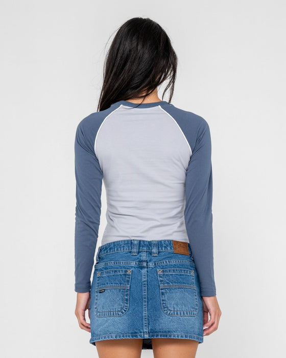 woman-wearing-timmy-target-l-s-fitted-tee-in-retro-blue