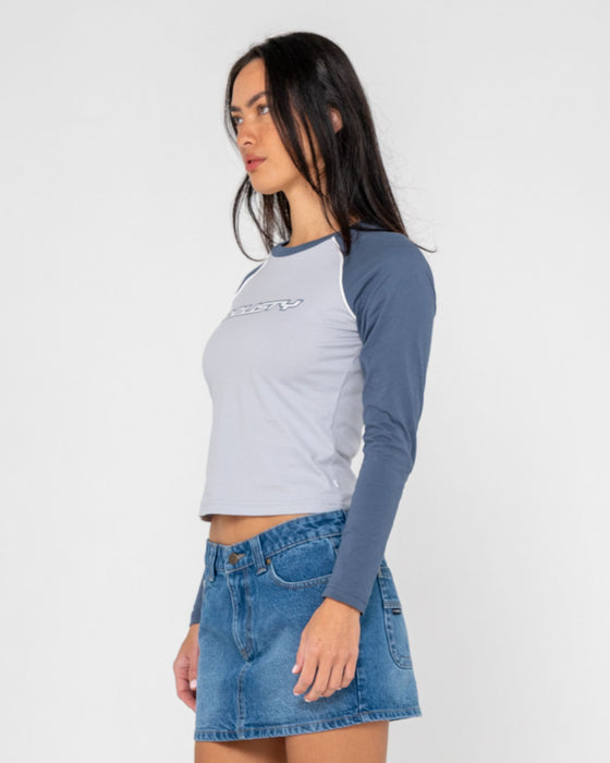 woman-wearing-timmy-target-l-s-fitted-tee-in-retro-blue