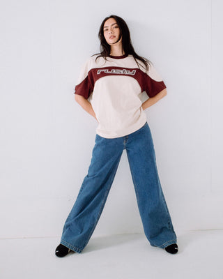 Woman wearing Kinetic Oversize Tee in Cream / Burgundy
