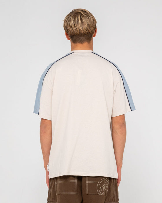 man-wearing-alonso-short-sleeve-tee-in-cream