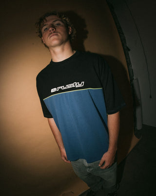 Man wearing Infinity Short Sleeve Tee in Atlantic Blue