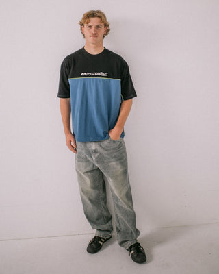 Man wearing Infinity Short Sleeve Tee in Atlantic Blue