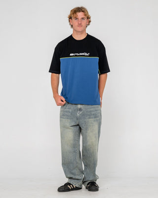 Man wearing Infinity Short Sleeve Tee in Atlantic Blue