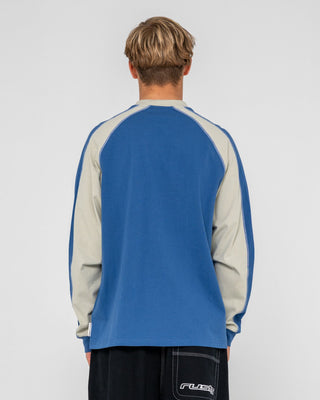 Man wearing Fade-r Long Sleeve Tee in Atlantic Blue