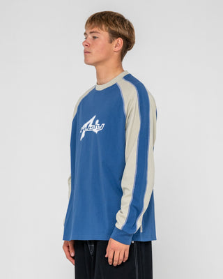 Man wearing Fade-r Long Sleeve Tee in Atlantic Blue