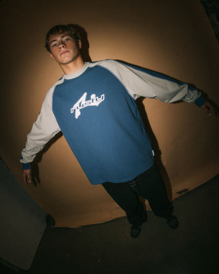 Man wearing Fade-r Long Sleeve Tee in Atlantic Blue