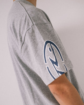 Man wearing Glaze-r Short Sleeve Tee in Grey Marle