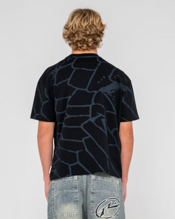man-wearing-taipan-short-sleeve-tee-in-black
