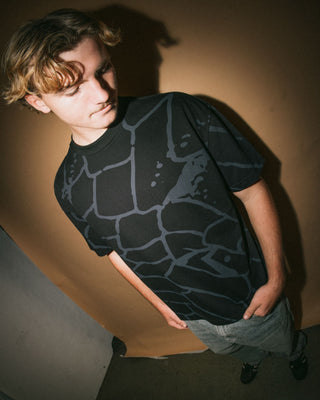 Man wearing Taipan Short Sleeve Tee in Black