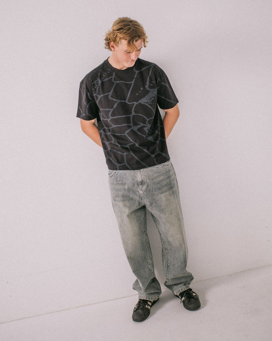 man-wearing-taipan-short-sleeve-tee-in-black