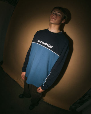 Man wearing Infinity Long Sleeve Tee in Atlantic Blue