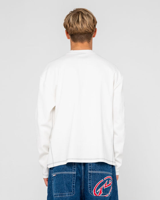 man-wearing-slack-jack-long-sleeve-heavy-tee-in-white