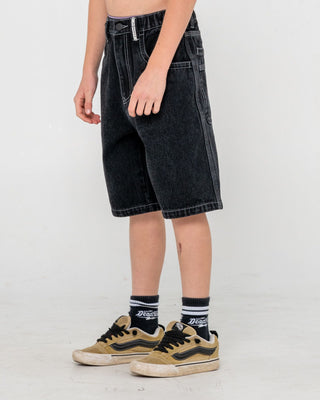 Boy wearing Dr. Dot Baggy Jort Boys in Black Out