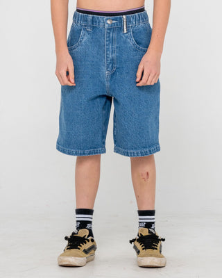 Boy wearing Dr. Dot Baggy Jort Boys in Middy Blue
