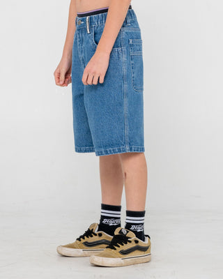 Boy wearing Dr. Dot Baggy Jort Boys in Middy Blue