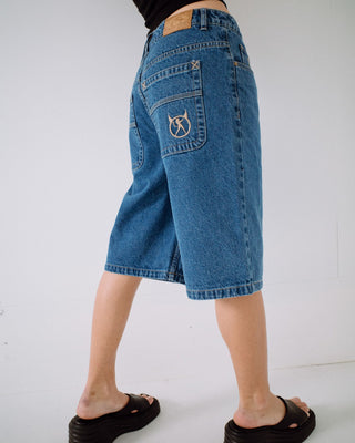 Woman wearing Bethany Baggy Low Rise Denim Jort in Middy Blue