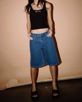 Woman wearing Bethany Baggy Low Rise Denim Jort in Middy Blue