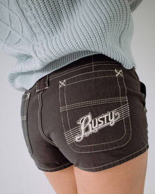 Woman wearing Dirtbag Cargo Low Rise Mini Short in Carbon