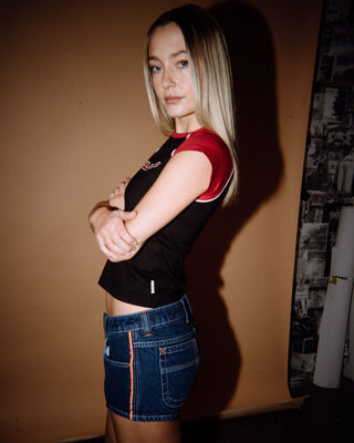 Woman wearing Flip Mommy Low Rise Micro Mini Short in Deep Sea Blue / Orange