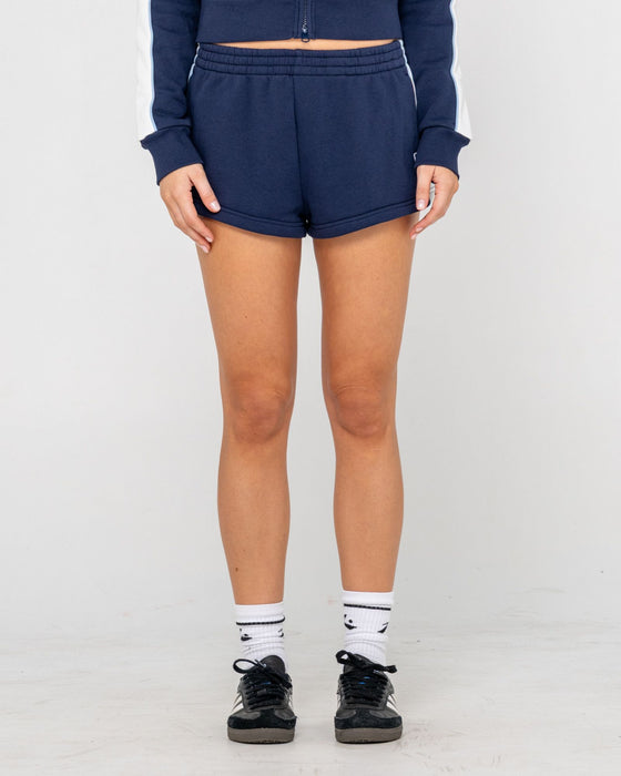 woman-wearing-retro-lines-mini-fleece-short-in-navy-blue