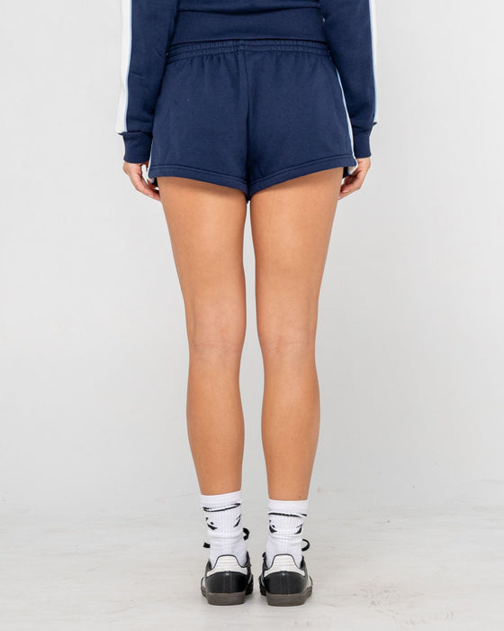 woman-wearing-retro-lines-mini-fleece-short-in-navy-blue