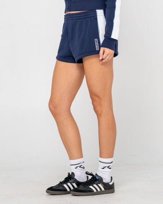 Woman wearing Retro Lines Mini Fleece Short in Navy Blue