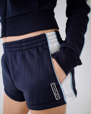 Woman wearing Retro Lines Mini Fleece Short in Navy Blue