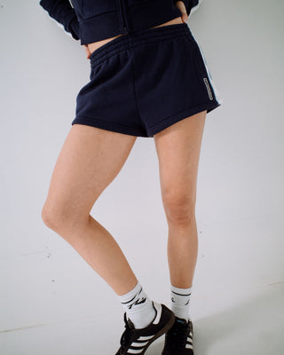 Woman wearing Retro Lines Mini Fleece Short in Navy Blue