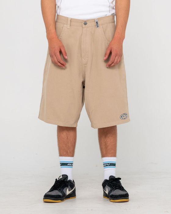 man-wearing-step-stone-baggy-short-in-abbey-stone