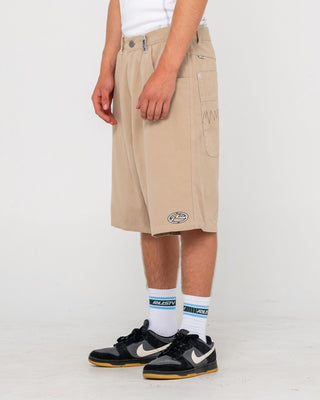 Man wearing Step-stone Baggy Short in Abbey Stone